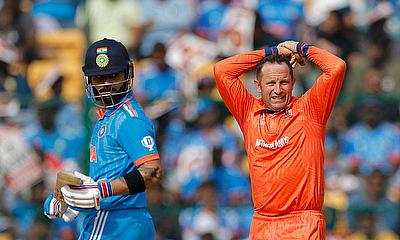 India's Virat Kohli and Netherlands' Roelof van der Merwe react alt=