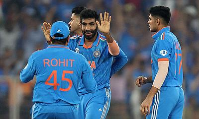 India's Jasprit Bumrah celebrates with Rohit Sharma after taking the wicket of Australia's Mitchell Marsh, caught out by KL Rahul alt=