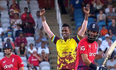 Akeal Hosein celebrates the wicket of Moeen Ali