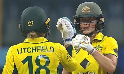 Phoebe Litchfield and Ellyse Perry fist bump