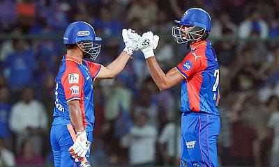 Delhi Capitals captain Rishabh Pant congratulates his teammate Axar Patel for his half-century alt=