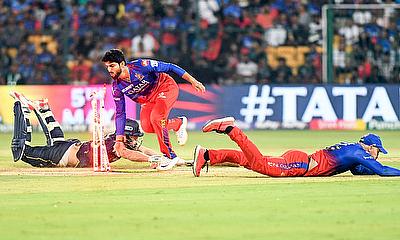 Gujarat Titans' David Miller dives to reach the crease avoiding a run-out alt=
