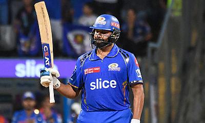 Mumbai Indians' Rohit Sharma celebrates his half-century alt=