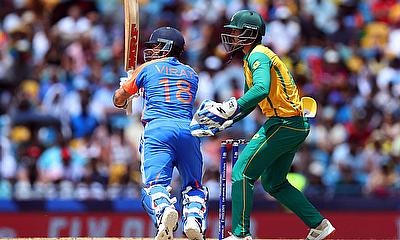 India's Virat Kohli and South Africa's Quinton de Kock in action alt=