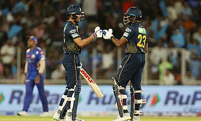 Gujarat Titans' Sai Sudharsan and Shubman Gill bump fists during their innings alt=