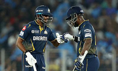 Gujarat Titans' Sai Sudharsan bumps fists with Sherfane Rutherford during their innings
