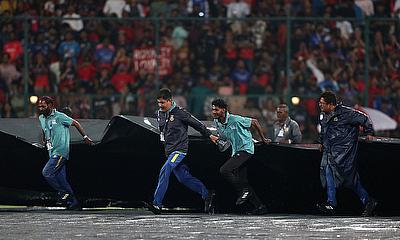 General view as ground staff remove the covers ahead of the days play alt=