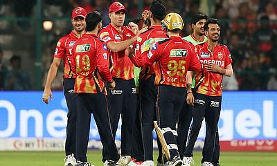 Punjab Kings players celebrate the wicket of Royal Challengers Bengaluru's Bhuvneshwar Kumar alt=