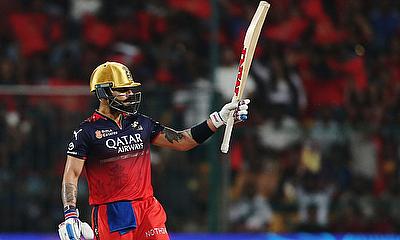 Royal Challengers Bengaluru's Virat Kohli celebrates after reaching his half century alt=