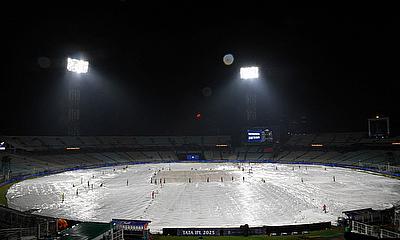General view of covers on the field during a rain delay