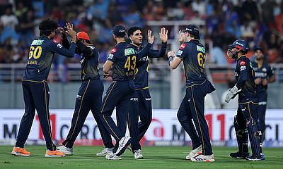 Gujarat Titans' Sai Kishore celebrates with teammates alt=