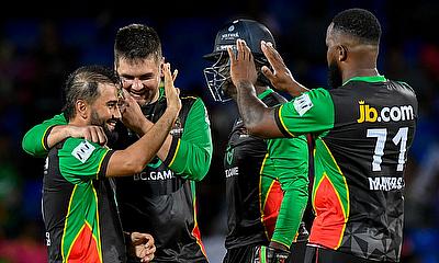 Waqar Salamkheil (L) and Rilee Rossouw (R) of Saint Kitts and Nevis Patriots celebrate