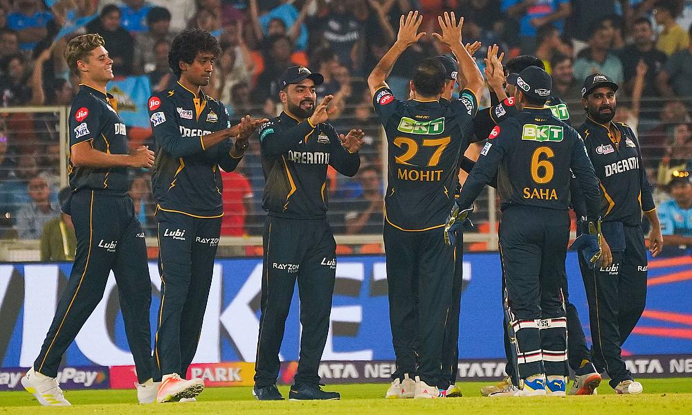 Gujarat Titans players celebrate the wicket of Mumbai Indians' Ishan Kishan during the IPL 2024 Gujarat Titans players celebrate the wicket of Mumbai Indians' Ishan Kishan during the IPL 2024