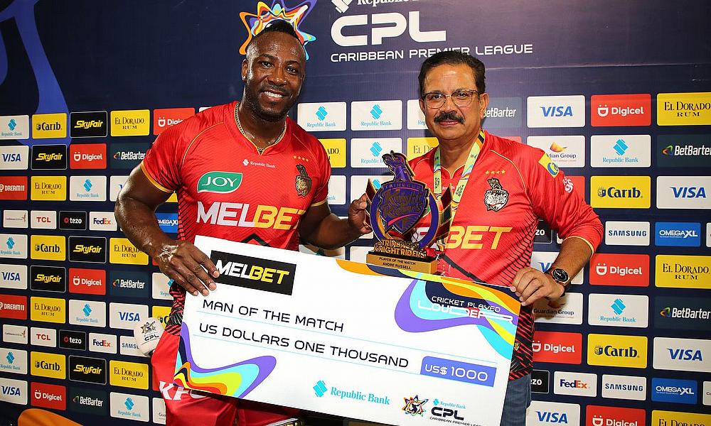 Man of the Match Andre Russell of Trinbago Knight Riders collects his awards from Venky Mysore Man of the Match Andre Russell of Trinbago Knight Riders collects his awards from Venky Mysore
