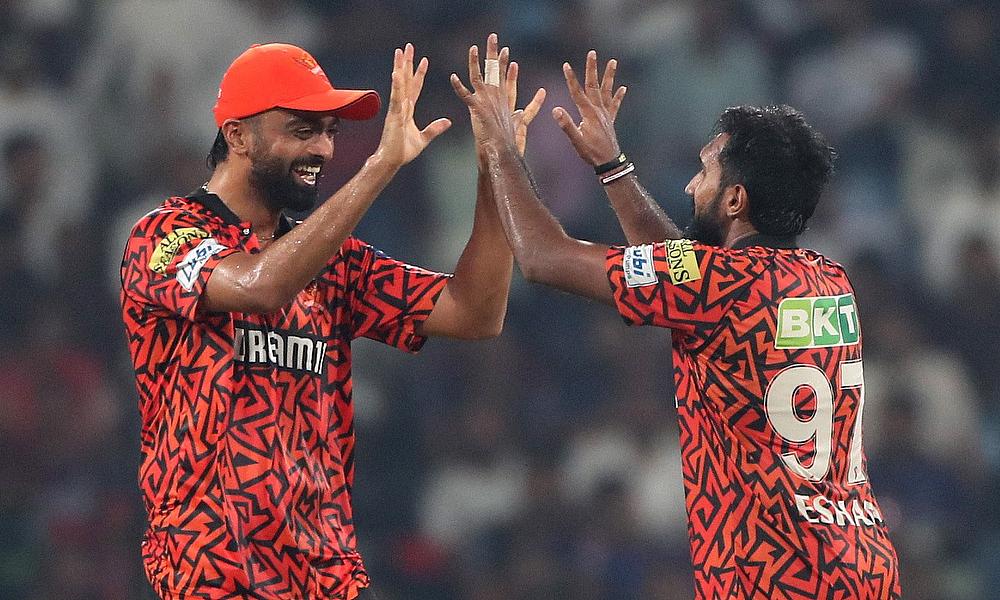 Sunrisers Hyderabad's Eshan Malinga celebrates after taking the wicket of Royal Challengers Bengaluru's Tim David caught out by Sunrisers Hyderabad's Heinrich Klaasen