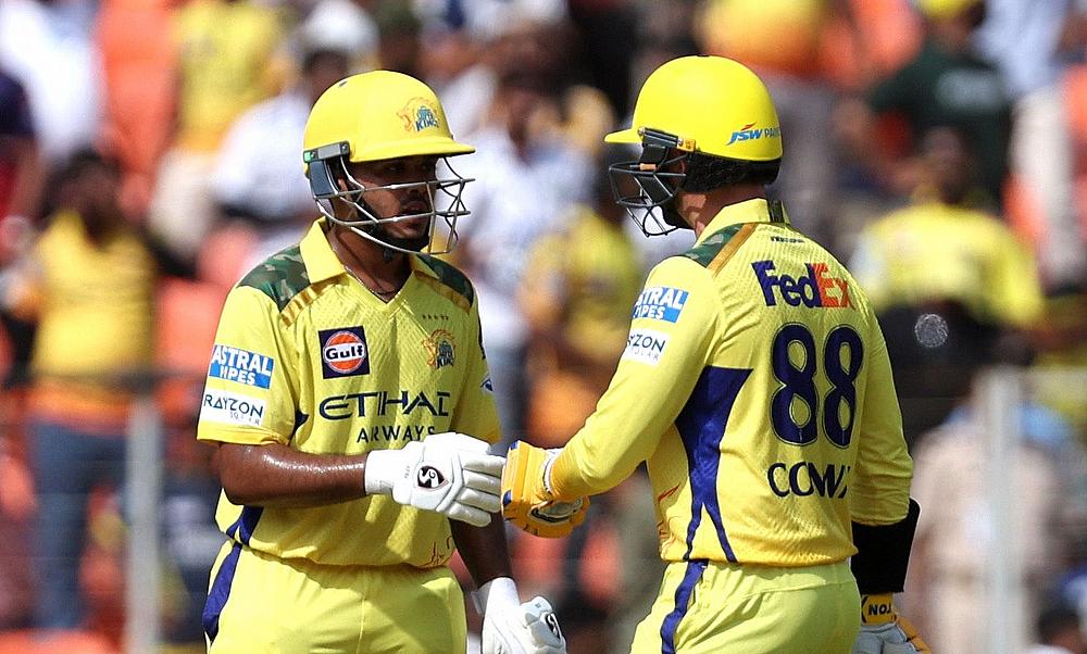 Chennai Super Kings' Ayush Mhatre interacts with Devon Conway