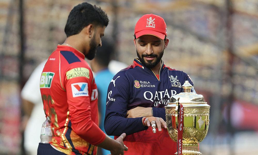 Royal Challengers Bengaluru's Rajat Patidar and Punjab Kings' Shreyas Iyer with the IPL trophy before the final