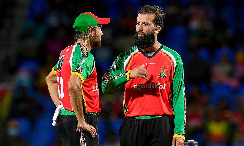 Imran Tahir (L) and Moeen Ali (R) of Guyana Amazon Warriors