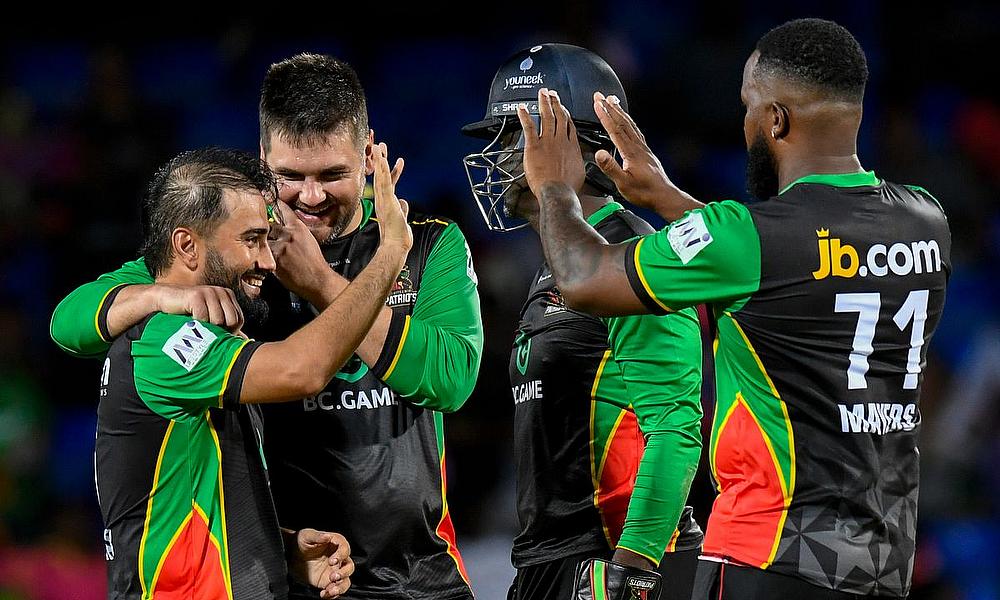 Waqar Salamkheil (L) and Rilee Rossouw (R) of Saint Kitts and Nevis Patriots celebrate