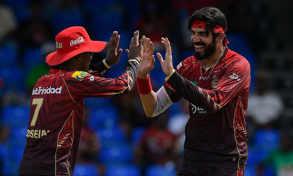 Usman Tariq (R) of Trinbago Knight Riders celebrates